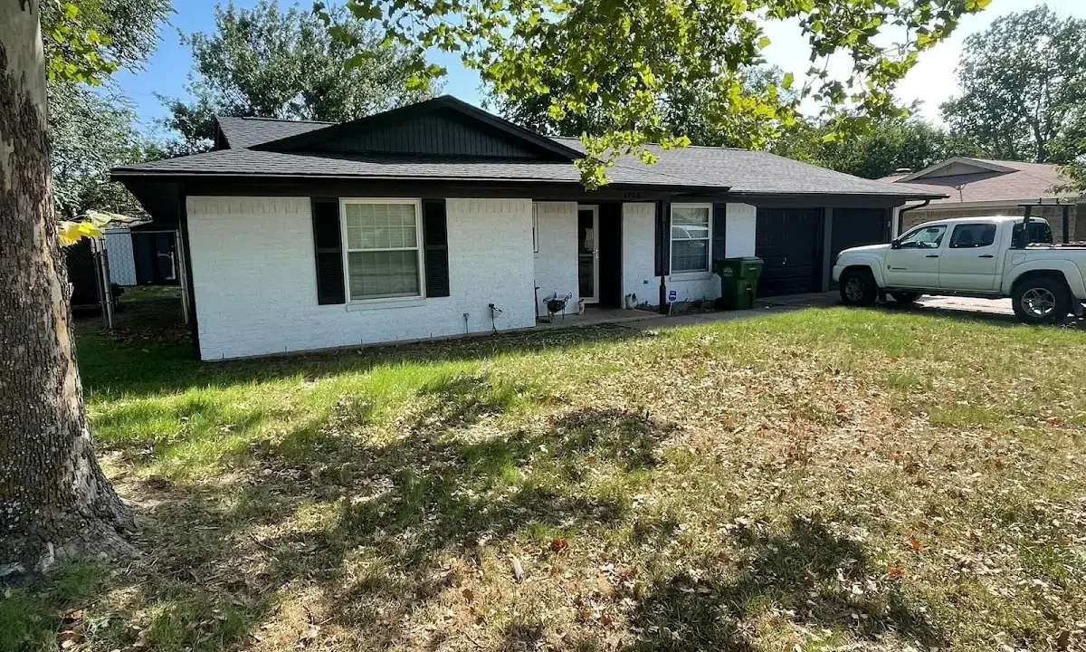 Professional roofing crew working on a residential roof in Lynwood